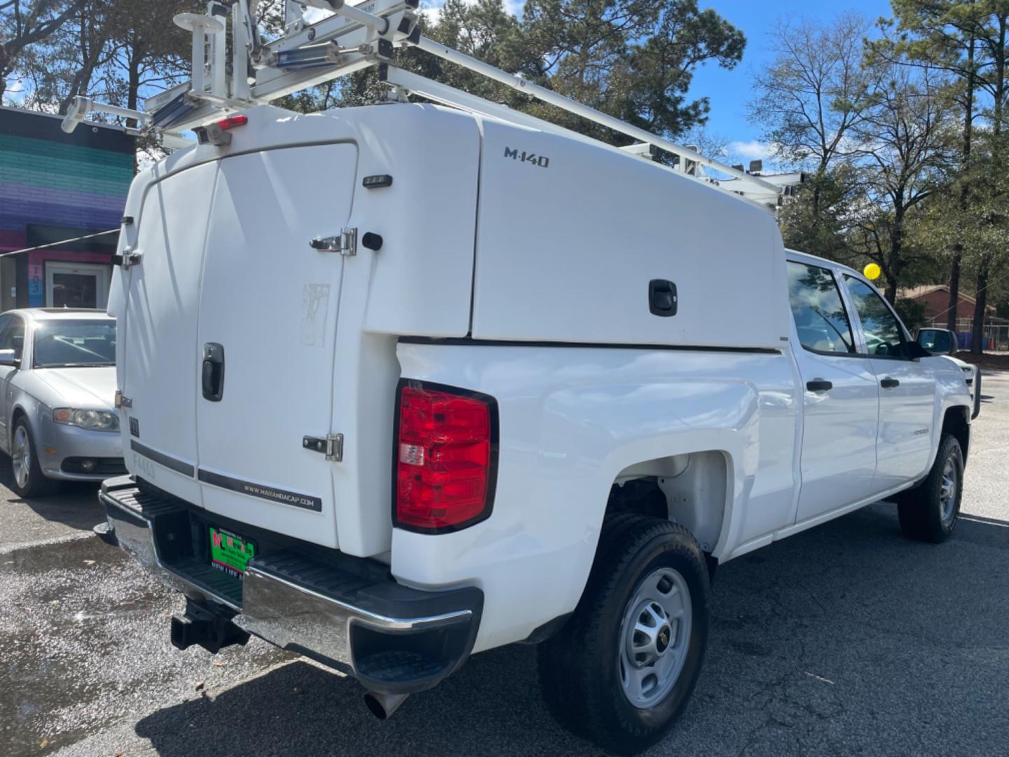 2015 WHITE CHEVROLET SILVERADO 2500H WORK TRUCK (1GC1KUEG7FF) with an 6.0L engine, Automatic transmission, located at 5103 Dorchester Rd., Charleston, SC, 29418-5607, (843) 767-1122, 36.245171, -115.228050 - Local Trade-in with Easy Clean Vinyl Interior, Backup Camera, AM/FM/AUX, Spacious Rear Seat, Power Windows, Power Locks, Power Mirrors, Utility Cab with Storage All Around, Pull Out Bed Storage, Ladder Rack, Safety Strobe Lights, Keyless Entry, Tow Package with Brake Assist, 4-Wheel Drive, Brush Gua - Photo#6